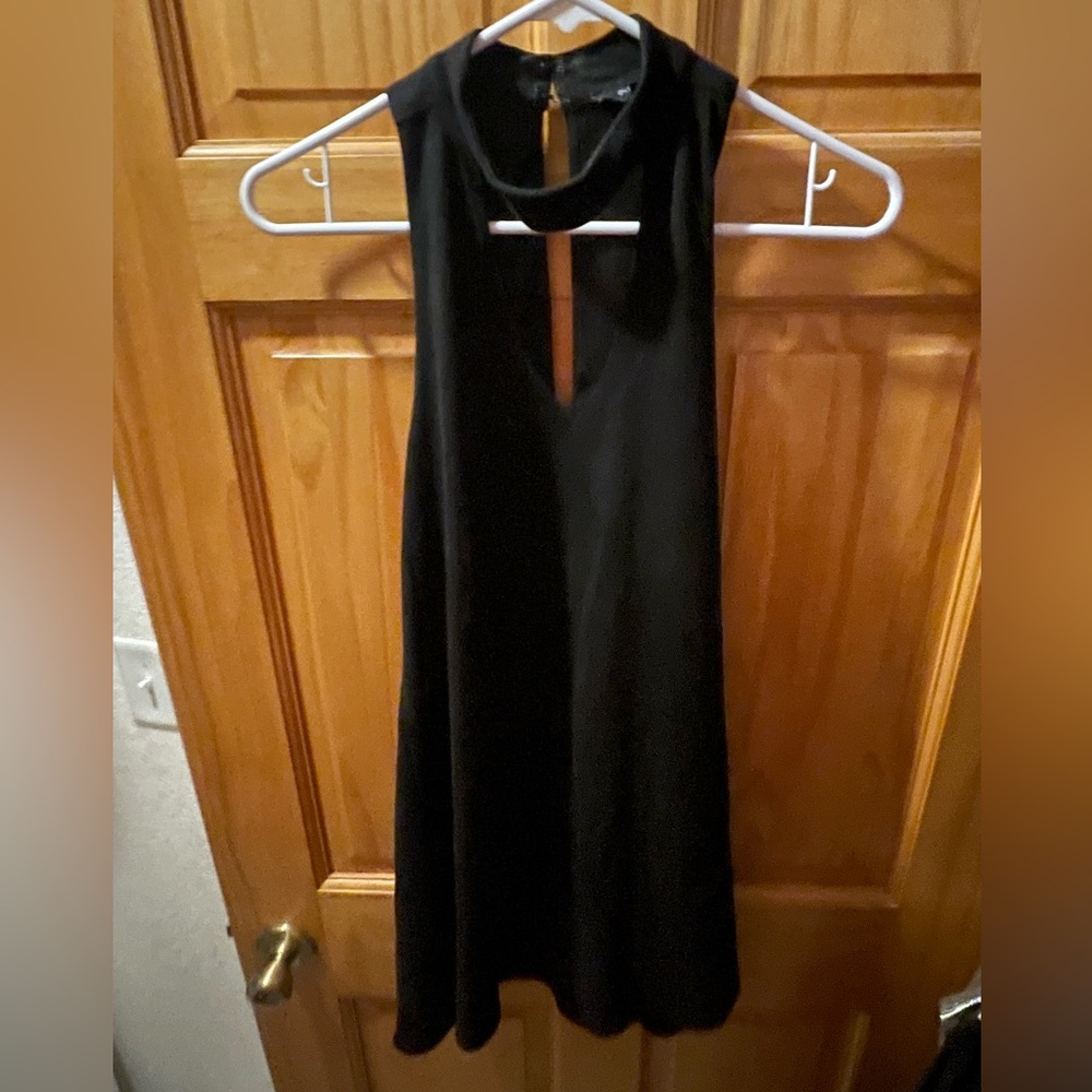 Cute black mini dress. Size medium. Front cut out.